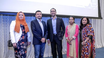 Winners of Western Union’s Ramadan programme, 30 Days of Betters. Gelan Mohammed; Jean Claude Farah, President of Western Union, Anil Mulchandani; Juliet Mathew and Shri Ranjini. Victor Besa for The National