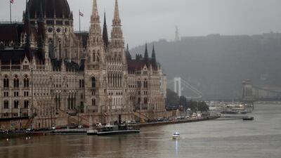 A police boat is seen on Danube river in front of the Hungarian Parliament in Budapest, Hungary, May 30, 2019. REUTERS/Bernadett Szabo