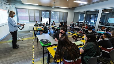 Yellow and black tape marks an area on the floor for teachers to be socially distanced from students in class at Melba Secondary College in Melbourne, Australia. All primary and high school students in Melbourne are able to return to their classrooms as of today, as part of Victoria's second step in the government's roadmap to reopening. Victoria's coronavirus restrictions were eased slightly across Melbourne from Monday 28 September. Metropolitan Melbourne has been subject to Stage 4 restrictions since 2 August 2020 in response to the re-emergence of COVID-19 in the community. Getty Images