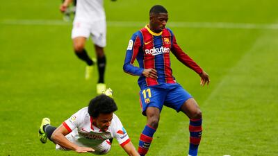 Barcelona attacker Ousmane Dembele and Sevilla's Jules Kounde. Reuters