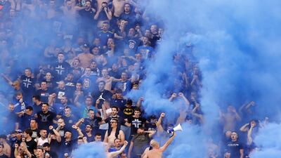 Supporters of Dinamo light flares. EPA