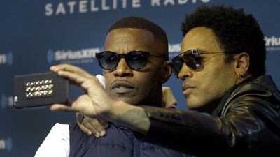 Singer Lenny Kravitz, right, takes a self portrait with Jamie Foxx after an appearance on Foxx’s SiriusXM show Friday Jan. 30, 2015, in Phoenix. Kravitz is performing alongside Katy Perry in the halftime show during Super Bowl XLIX on Sunday and said he is rooting for the Seattle Seahawks. Charlie Riedel / AP photo