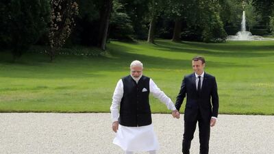 Indian Prime Minister Narendra Modi and French President Emmanuel Macron in the garden of the Elysee Palace in Parison June 3, 2017. AFP / POOL / JACQUES DEMARTHON