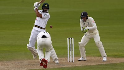 Pakistan's Shan Masood lets fly and has an England fielder ducking for cover. PA