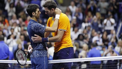 epa07009353 Novak Djokovic of Serbia (L) and Juan Martin del Potro of Argentina at the net after the men's final on the fourteenth day of the US Open Tennis Championships the USTA National Tennis Center in Flushing Meadows, New York, USA, 09 September 2018. The US Open runs from 27 August through 09 September. EPA/JUSTIN LANE *** Local Caption *** 53000073