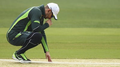 Michael Clarke inspects the pitch during an Australia nets session at the Adelaide Oval on Monday. Ryan Pierse / Getty Images / December 8, 2014