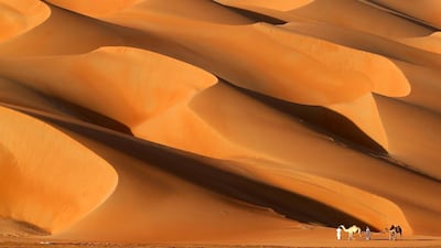 Chongqing Jiaotong University scientists showed fruit and vegetables harvested in dunes identical to those of Al Ain. Karim Sahib / AFP