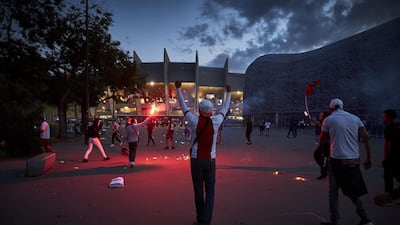 Paris Saint-Germain fans taunt French riot police outside PSG's Parc des Princes. Getty
