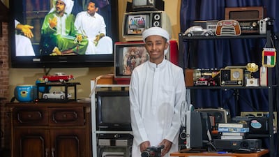 Juma Mubarak Al Ali with his collection of vintage electronics in his family home in Umm Al Quwain. Leslie Pableo for The National