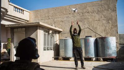 Soldiers from the Iraqi Special Forces 2nd division launch a drone to look for ISIL positions during fighting in Mosul on November 13, 2016. Odd Andersen / AFP
