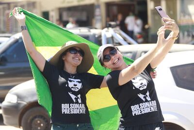 Supporters of candidate to the presidency of Brazil for the Liberal Social Party (PSL), Jair Bolsonaro, participate in a campaign event in Brasilia, Brazil. EPA