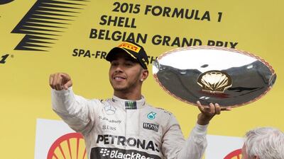 Formula One leader Lewis Hamilton celebrates on the podium after winning the Belgian Grand Prix on Sunday. Valdrin Xhemaj / EPA