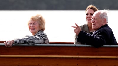 Kate speaks to Windemere Boy Arek Hersh and his partner Jean during the boat trip. AFP