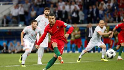 Portugal's Cristiano Ronaldo scores their first goal from the penalty spot. Francois Lenoir / Reuters