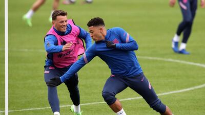 England's Ben White, left, and Jason Sancho. PA