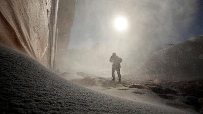 A worker passes a snow-making machine as preparations continue for the 2018 Winter Olympics at the Phoenix Snow Park in Pyeongchang, South Korea. Charlie Riedel / AP Photo