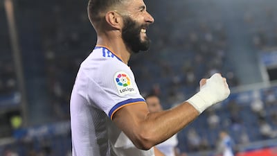 Benzema celebrates after scoring his side's third goal.