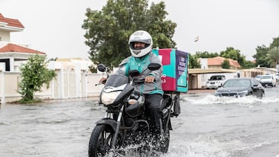 Commuters battle high water along the Al Manara and Beach road intersection. Antonie Robertson / The National