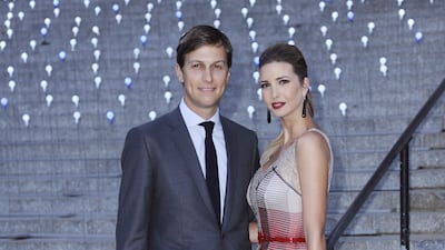 Ivanka Trump, wearing a grey dress with red plaid detail, and husband Jared Kushner attend a Tribeca Film Festival party on April 17, 2012. EPA