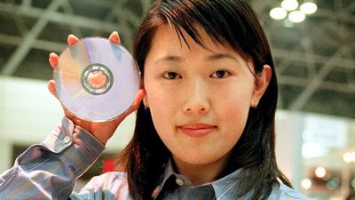 A campaign girl shows off new portable computer "DynaBook TECRA780 DVD/8.1" in 1998. The new computer was priced at 788,000 yen in Japan and at $5,899 in the US. AFP