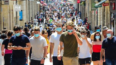 People stroll down Bordeaux's main shopping street Sainte-Catherine, where wearing a mask is compulsory. AFP