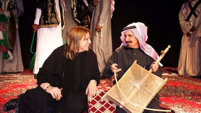 Author Lisa Urkevich, above left, with a traditional musician in Hail, a city in north-west Saudi Arabia. Courtesy Lisa Urkevich