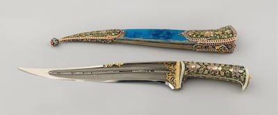 Ornamented dagger and scabbard, presented by the Maharaja of Alwar. Featuring an enamelled and bejewelled handle and a scabbard, the blade is filled with loose seed pearls. Courtesy Royal Collection Trust © Her Majesty Queen Elizabeth II 2017