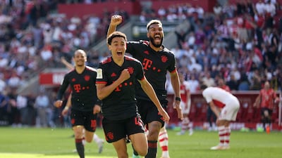 Bayern Munich's Jamal Musiala celebrates scoring the match-winning second goal with Eric Maxim Choupo-Moting against Cologne on May 27, 2023. Reuters
