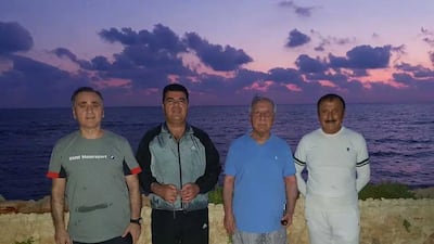 Ibrahim Huweija, far right, former Syrian air force intelligence chief, stands next to Bahjat Suleiman, a former Syrian ambassador to Jordan, and two others in Jableh, Latakia in 2019. Photo: Facebook