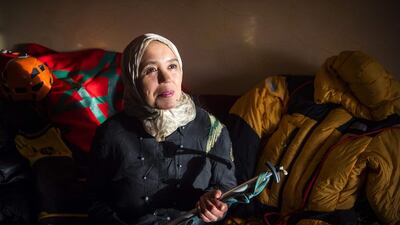 Moroccan mountaineer Bouchra Baibanou is pictured in her home with a hiking cane in the Sidi Moussa district of Sale near Rabat. She is the first Moroccan to scale the seven summits of the world's continents. AFP
