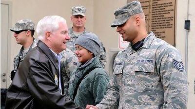 Defence secretary Robert Gates meets troops outside a hospital in Kabul.