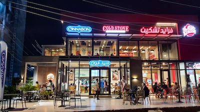 A short distance away from KFC, the aroma of freshly baked cinnamon rolls wafts across the street