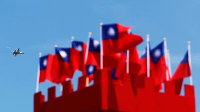 A Taiwanese-built Indigenous Defence Fighter performs at Gangshan air force base in Kaohsiung. Taiwan has threatened to intercept aircraft that threaten its security amid a dispute over air routes created by China. Tyrone Siu / Reuters