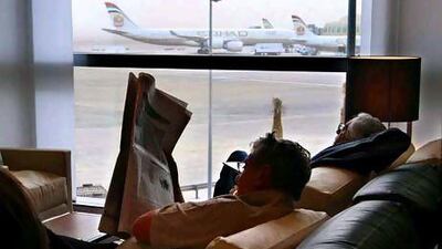 Passengers relax at the Terminal 3 Etihad business lounge at Abu Dhabi airport, which was used by a record number of travellers. Stephen Lock / The National