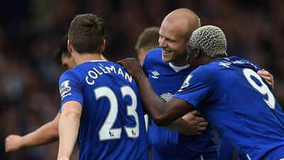 Steven Naismith his congratulated by teammates after scoring the second of his three goals against Chelsea. Paul Ellis / AFP