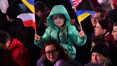 People gather to listen to a speech by US President Joe Biden at the Royal Castle in Warsaw, Poland, on March 26, 2022. EPA