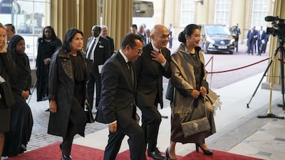 World leaders and heads of state arrive for the reception at Buckingham Palace in London. PA
