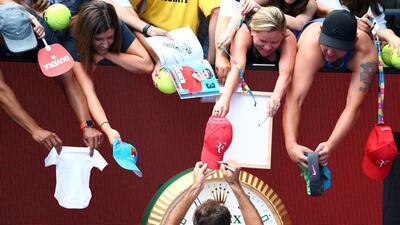 Roger Federer of Switzerland signs autographs for fans after winning his quarter final match against Tomas Berdych of the Czech Republic during day nine of the 2016 Australian Open at Melbourne Park in Melbourne, Australia. Scott Barbour / Getty Images