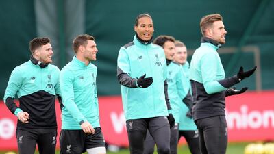 James Milner, centre left, and Virgil Van Dijk, centre right.