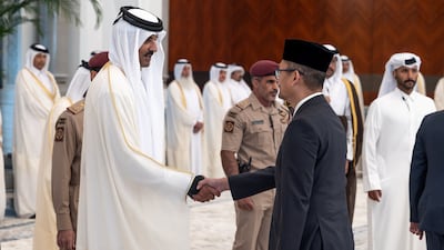 Sheikh Tamim shakes hands with a mourner as he receives condolences following the death of his father, Sheikh Hamad. The former leader was seen as one of the key architects of modern Qatar and led the country through a period of rapid economic growth. Photo: Qatar Amiri Diwan / Reuters