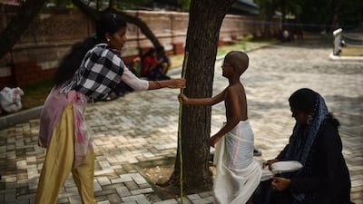 A boy in Chennai dresses as Mahatma Gandhi to mark the 153rd anniversary of the independence leader's birth. Gandhi's message of non-violent political protest has been heard by generations of Indians since his assassination in 1948. EPA