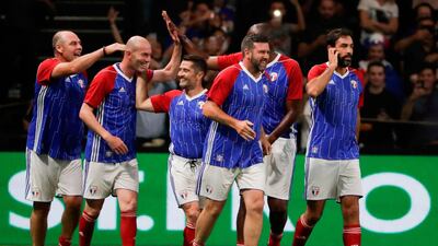 France 98's players celebrate after Zinedine Zidane scored a goal. Thomas Samson / AFP
