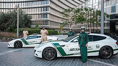 The Lamborghini Aventador, left, and the Ferrari FF were the first supercars to get the Dubai Police decal treatment. Courtesy Dubai Police