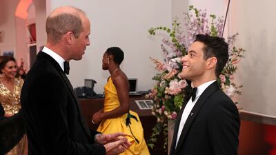 Prince William speaks with actor Rami Malek at the premiere of 'No Time to Die' in London on September 28, 2021. Reuters