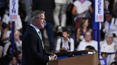 Former Republican politician Adam Kinzinger gives a speech at the event, held in the United Centre. AFP