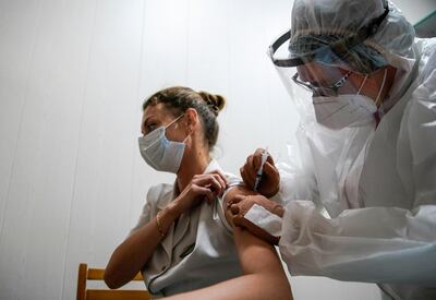 A medic of the regional hospital receives Russia's "Sputnik-V" vaccine shot against Covid-19 in Tver, Russia. Reuters