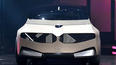 A BMW i Vision Circular concept car stands on the stage during a press presentation. AFP