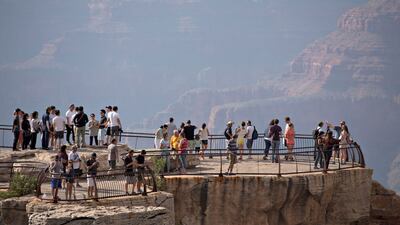 Visitors stand on an observation deck at Mather Point. Bloomberg