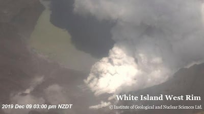 Smoke billowing above the crater of Whakaari, also known as White Island, volcano as it erupts in New Zealand. GNS Science via Reuters