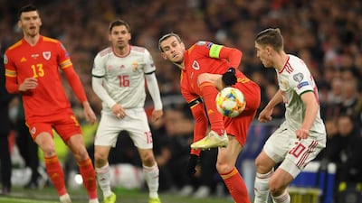 Gareth Bale, second right, controls the ball. Getty